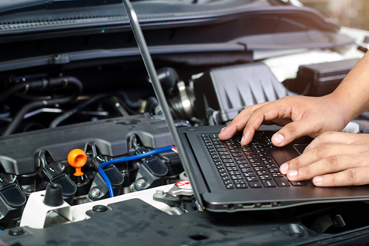 Laptop diagnostics on car engine